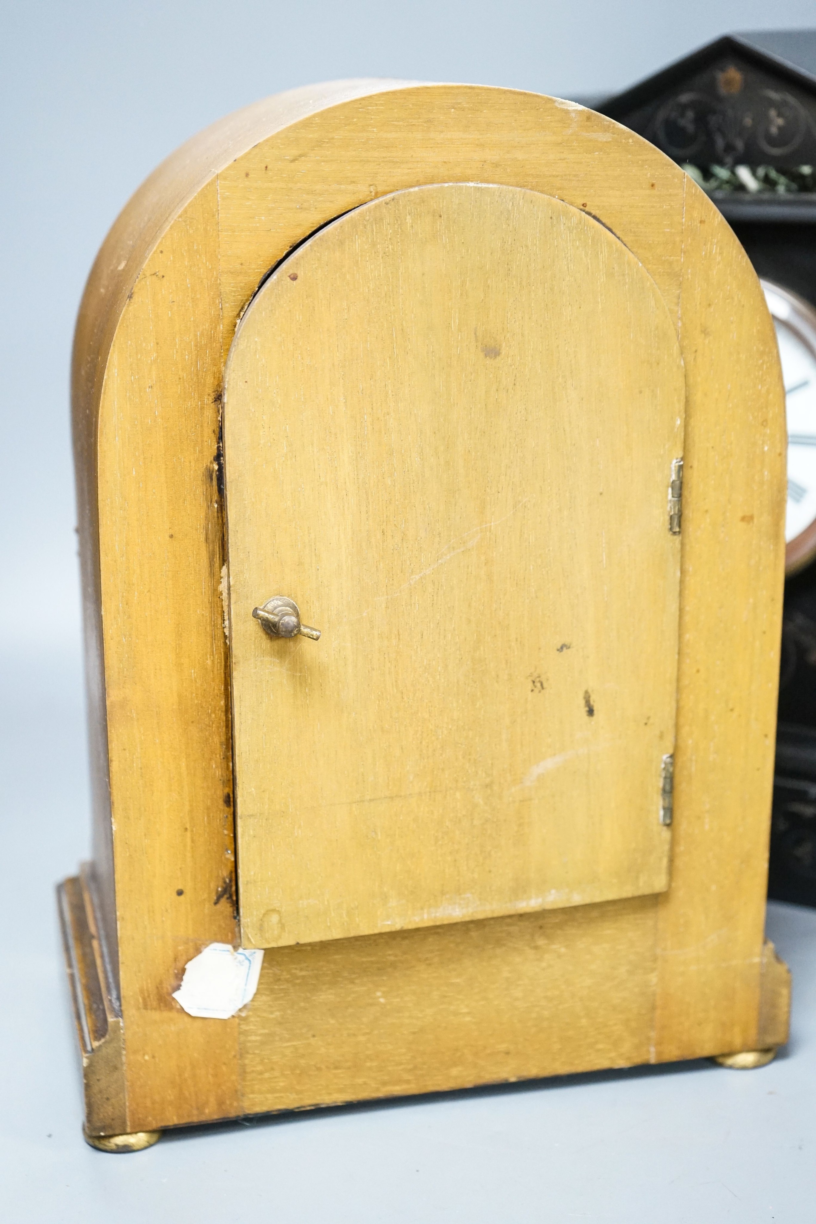 A Victorian slate clock and a 1930's arched clock